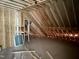 Newly constructed attic space with exposed framing at 316 Firefly Overlook, Pittsboro, NC 27312