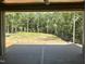 The backyard view with composite porch flooring shows spacious outdoor living at 316 Firefly Overlook, Pittsboro, NC 27312