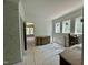 Bright bathroom showcasing a double vanity with large windows and doorway to shower at 316 Firefly Overlook, Pittsboro, NC 27312