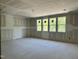 Large bedroom with ample sunlight through multiple windows, providing a bright and airy atmosphere at 316 Firefly Overlook, Pittsboro, NC 27312