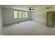 Spacious bedroom featuring a ceiling fan and large windows offering lots of natural light at 316 Firefly Overlook, Pittsboro, NC 27312