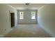 Bedroom with 2 windows offering lots of natural light at 316 Firefly Overlook, Pittsboro, NC 27312