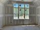 A bedroom featuring natural light with large windows, offering a bright and airy feel at 316 Firefly Overlook, Pittsboro, NC 27312