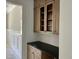 Butler pantry with upper cabinets and countertop at 316 Firefly Overlook, Pittsboro, NC 27312