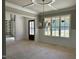 Dining room with wainscoting and large windows at 316 Firefly Overlook, Pittsboro, NC 27312