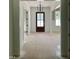Foyer with front door and view of formal dining room at 316 Firefly Overlook, Pittsboro, NC 27312
