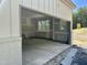 Open garage shows white painted brick detail on the lower portion and a window for natural light at 316 Firefly Overlook, Pittsboro, NC 27312
