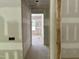 A well-lit hallway showcasing the layout and design elements of the new home build at 316 Firefly Overlook, Pittsboro, NC 27312