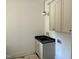 A modern laundry room features a sink with modern fixtures, and custom cabinets for ample storage at 316 Firefly Overlook, Pittsboro, NC 27312