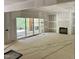 Living room featuring sliding glass doors to the backyard and a fireplace, ready to be personalized at 316 Firefly Overlook, Pittsboro, NC 27312