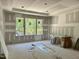 Spacious room with abundant natural light from large windows, ideal for a comfortable living space at 316 Firefly Overlook, Pittsboro, NC 27312