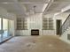 Living room with fireplace, built in shelving, and access to sun room at 316 Firefly Overlook, Pittsboro, NC 27312