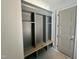 Mudroom with a bench and shelving is great for storage and organization when entering the home at 316 Firefly Overlook, Pittsboro, NC 27312