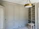 Sophisticated office with wainscoting, built-in shelves and designer lighting at 316 Firefly Overlook, Pittsboro, NC 27312