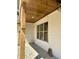 Charming covered porch with wood ceiling and detailed brickwork at 316 Firefly Overlook, Pittsboro, NC 27312
