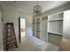 Bright, spacious walk-in closet with custom shelves, drawers and hanging racks at 316 Firefly Overlook, Pittsboro, NC 27312