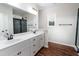 Bathroom with double sink vanity, large mirror and drawers, plus a glass-enclosed shower at 4466 Debnam Rd, Zebulon, NC 27597