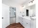 Bathroom with double sink vanity and drawers, plus a door leading to the bedroom at 4466 Debnam Rd, Zebulon, NC 27597