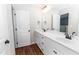 Bathroom with double sink vanity, ample counter space, and storage, alongside a door to the toilet at 4466 Debnam Rd, Zebulon, NC 27597