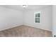 Bedroom features carpeted floor and a bright window at 4466 Debnam Rd, Zebulon, NC 27597