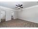Bright bedroom with plush carpet, crown molding, and a ceiling fan, showcasing a comfortable living space at 4466 Debnam Rd, Zebulon, NC 27597