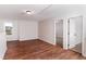 Bonus room with hardwood floors and natural light, offering a versatile space for various activities at 4466 Debnam Rd, Zebulon, NC 27597