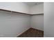 Walk-in closet with rod for storage and carpeted floor in a modern home at 4466 Debnam Rd, Zebulon, NC 27597
