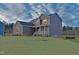 Beautiful two-story home featuring a charming front porch and manicured lawn at 4466 Debnam Rd, Zebulon, NC 27597