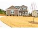 Charming two-story home boasting a lush front lawn and welcoming curb appeal at 4466 Debnam Rd, Zebulon, NC 27597