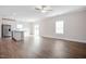 Spacious living area with hardwood floors, natural light, and a view into the kitchen at 600 Rhino Bnd, Oxford, NC 27565