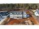 Stunning exterior elevation of a new construction home with a gray roof and covered front porch at 4813 Parker Meadow Dr, Raleigh, NC 27614