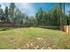 Large fenced backyard with grassy area, perfect for outdoor activities at 21 Walnut Hall Ct, Selma, NC 27576