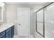Modern bathroom with blue vanity and glass shower at 21 Walnut Hall Ct, Selma, NC 27576