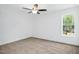 Well-lit bedroom with ceiling fan and carpeted floor at 21 Walnut Hall Ct, Selma, NC 27576