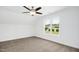Spacious bedroom with ceiling fan and window views at 21 Walnut Hall Ct, Selma, NC 27576