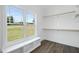 Large walk-in closet with built-in shelves and window seat at 21 Walnut Hall Ct, Selma, NC 27576