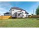 White two-story house with screened porch and backyard at 21 Walnut Hall Ct, Selma, NC 27576