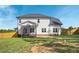 White two-story house with screened porch and fenced backyard at 21 Walnut Hall Ct, Selma, NC 27576
