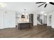 Open concept kitchen with island, hardwood floors, and staircase at 21 Walnut Hall Ct, Selma, NC 27576