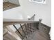 Elegant staircase with dark wood and black metal railings at 21 Walnut Hall Ct, Selma, NC 27576