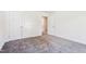Bedroom with gray carpet, white walls, and closet at 83 Artic Circle, Garner, NC 27529