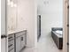Elegant bathroom featuring a double vanity, stylish marble floors, shower, and soaking tub at 83 Artic Circle, Garner, NC 27529