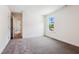 This bedroom boasts plush carpet, natural light, and a view of the outdoors at 83 Artic Circle, Garner, NC 27529