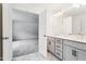 Bathroom with double sink vanity, marble floors, and ample lighting at 83 Artic Circle, Garner, NC 27529
