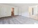 Spacious bedroom featuring plush carpet, and doorways that give way to a bathroom and a stairway at 83 Artic Circle, Garner, NC 27529