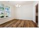 Well-lit bedroom with grey carpet and large window at 83 Artic Circle, Garner, NC 27529