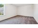 Bedroom with gray carpet, white walls, and a bright window at 83 Artic Circle, Garner, NC 27529