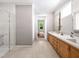 Bathroom featuring a shower, and a vanity with double sinks, quartz countertop at 154 Colonial Trail Ct, Pittsboro, NC 27312