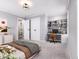 Bedroom featuring a built in desk and shelving unit with an adjoining bathroom at 154 Colonial Trail Ct, Pittsboro, NC 27312