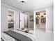 Open bedroom with doors leading to ensuite bathroom and walk-in closet at 154 Colonial Trail Ct, Pittsboro, NC 27312
